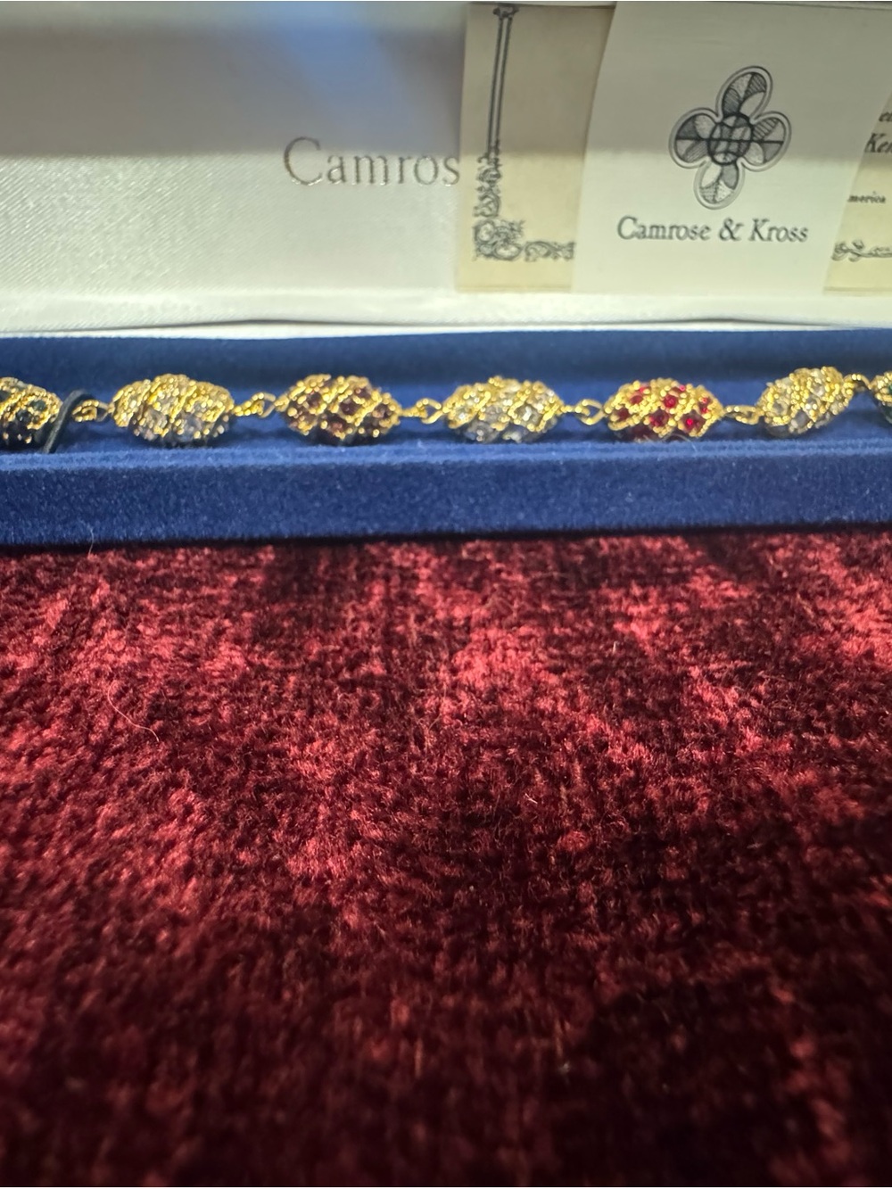 Gold-Tone Bracelet with Red and Blue Crystal Accents